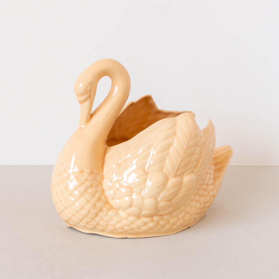 Vintage ceramic swan planter finished in soft orange glaze at Inner Beach Co, Toronto, Canada