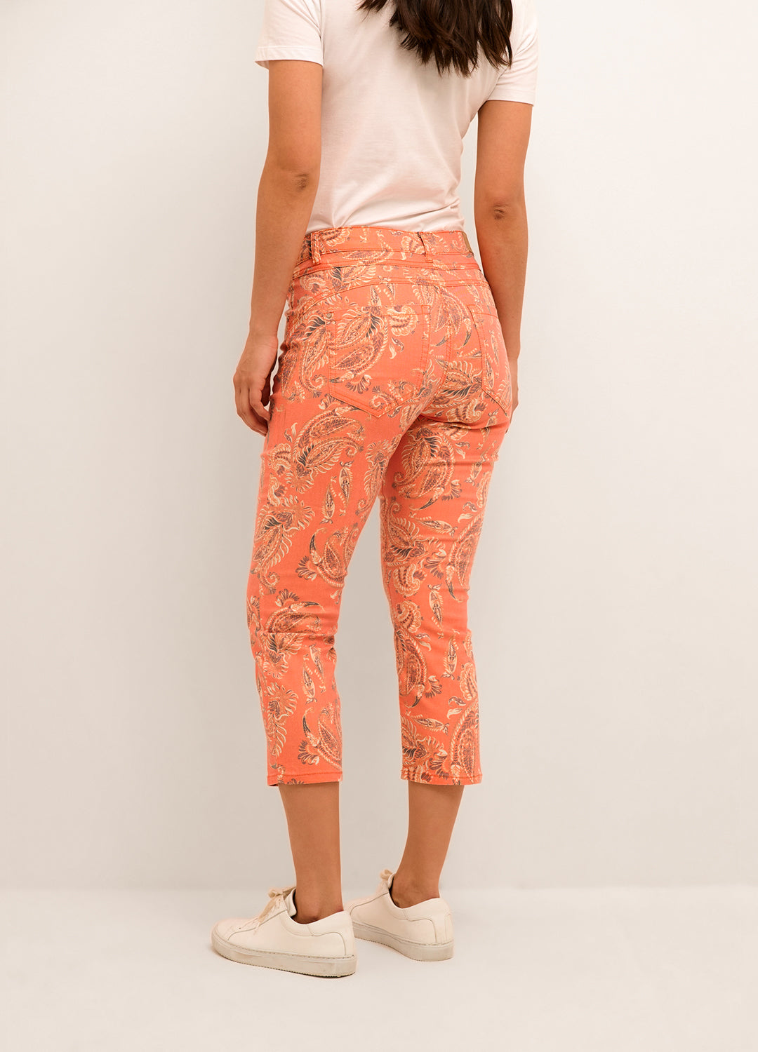 Back view of the Cream Clothing Denmark Kaiza 3/4 Printed Twill Jeans in Exotic Orange Paisley pattern at Inner Beach Co, Toronto, Ontario, Canada