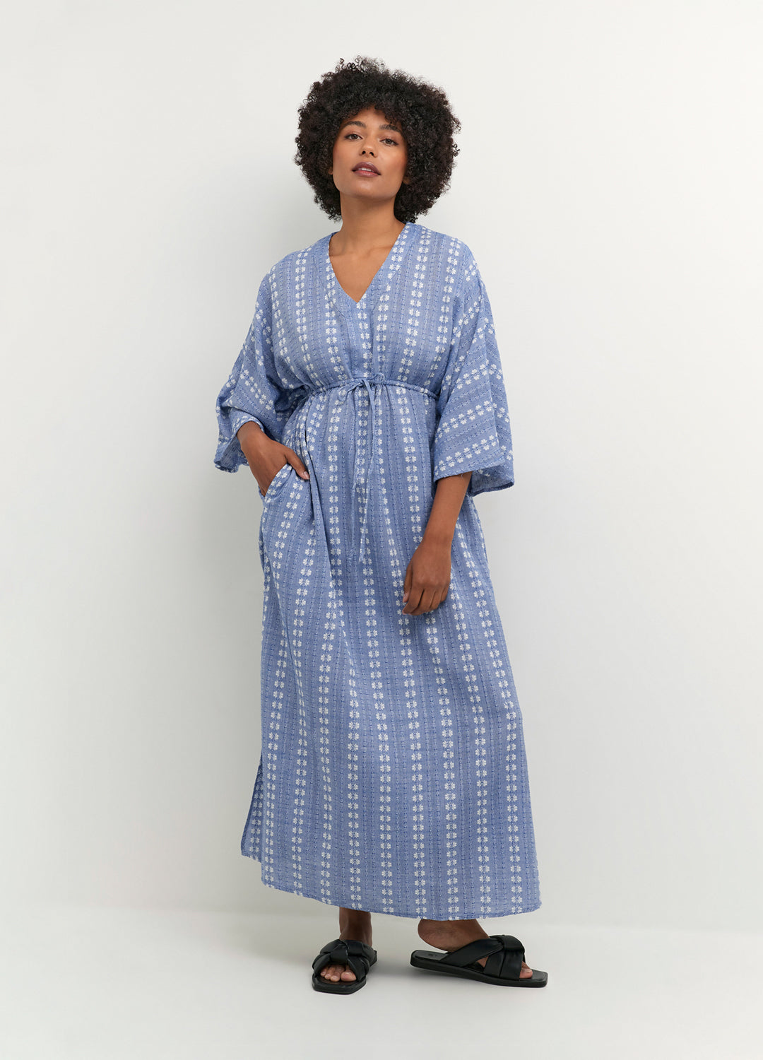 Additional alternate front view of the Culture Adriette Dress in Ultramarine blue pattern with a loose, flowy silhouette at Inner Beach Co, Toronto, Ontario, Canada