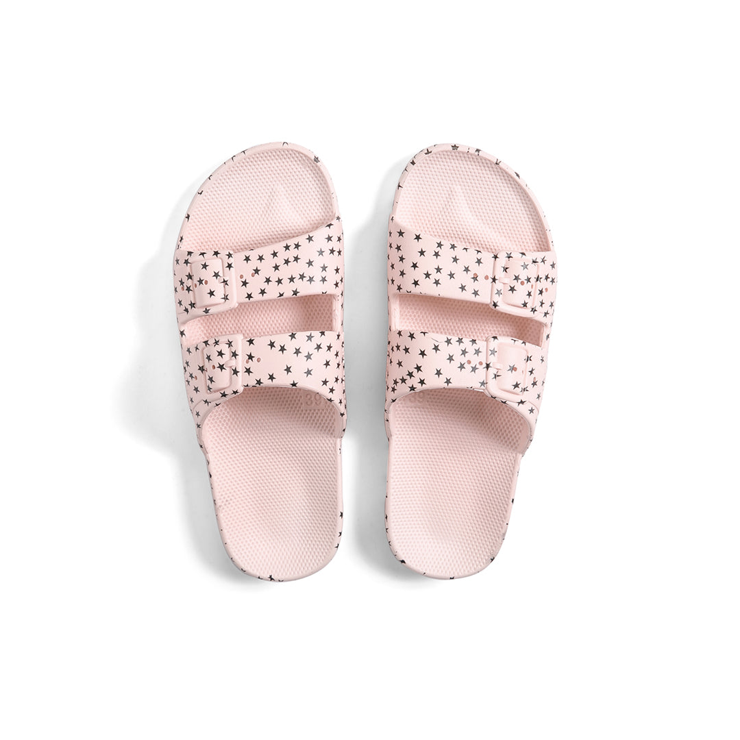 Freedom Moses waterproof fixed buckle Slides sandals in Stellar Rosa black stars on soft pastel pink at Inner Beach Co, Toronto, Ontario, Canada