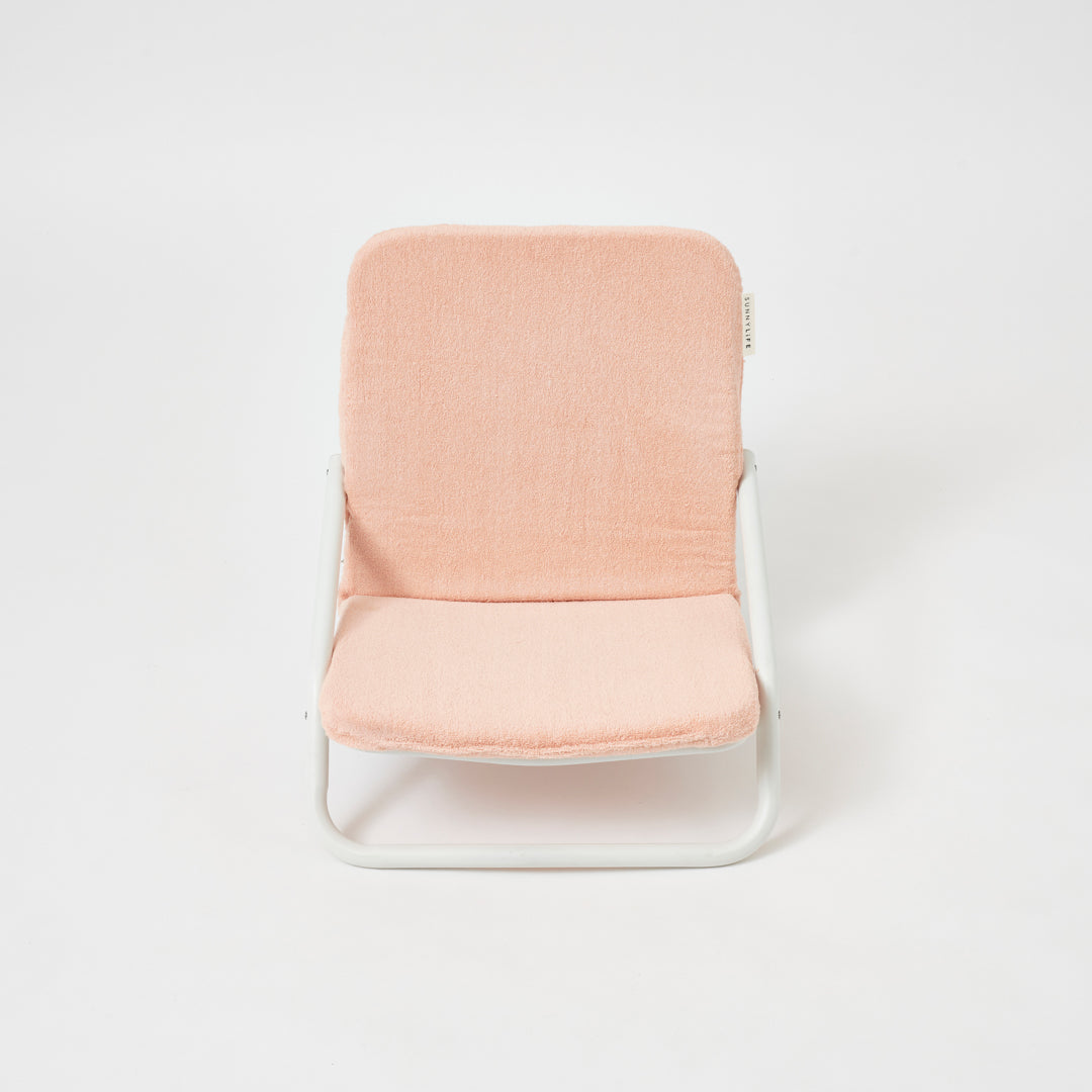 SUNNYLiFE Australia foldable Cushioned Beach Chair with a removable terry towelling padded cushion in soft Salmon pink colour at Inner Beach Co, Toronto, Ontario, Canada