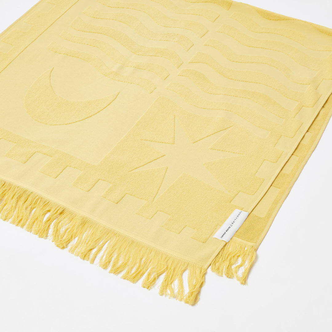 SUNNYLiFE X Daimon Downey Skinny Dipper Luxe Beach Towel in soft yellow colour made from premium 420gsm Jacquard cotton terry towelling at Inner Beach Co, Toronto, Canada