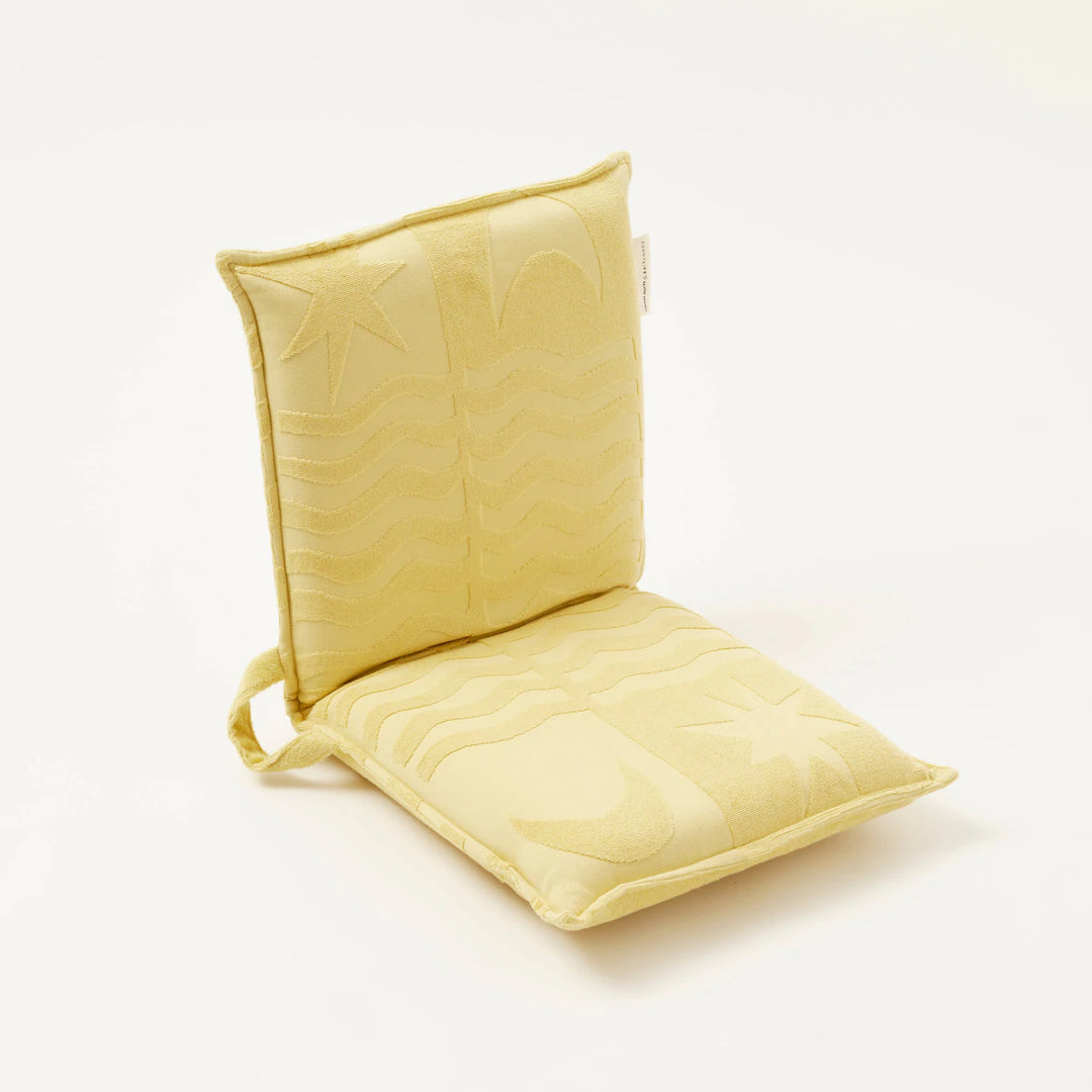 Limited edition SUNNYLiFE X Daimon Downey Terry Travel Lounger Chair in skinny dipper yellow with 6 adjustable reclining settings at Inner Beach Co, Toronto, Ontario, Canada
