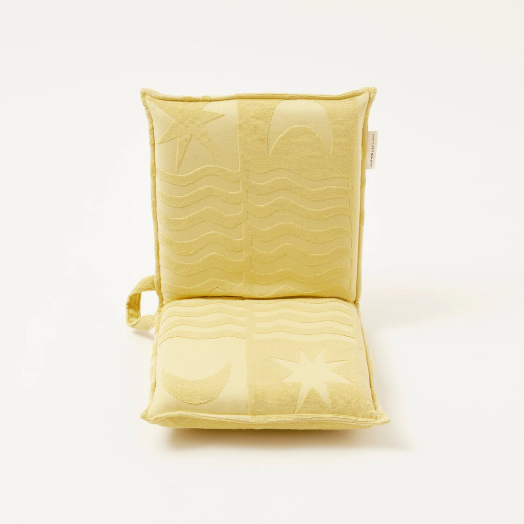 Limited edition SUNNYLiFE X Daimon Downey Terry Travel Lounger Chair in skinny dipper yellow with 6 adjustable reclining settings at Inner Beach Co, Toronto, Ontario, Canada