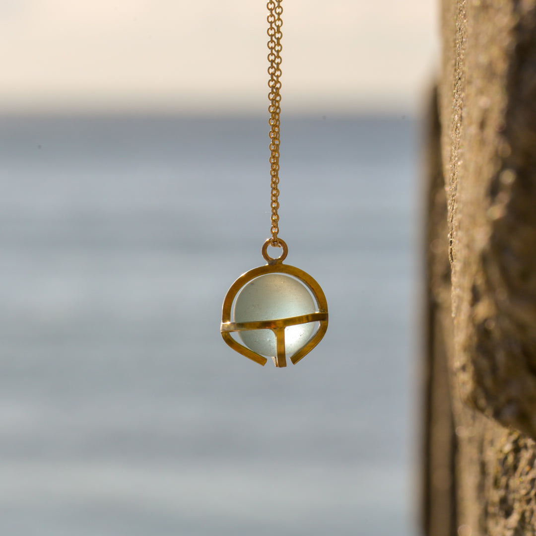 Kate Samson Gold and Lake Ontario Beach Glass Marble Caged Pendant Necklace in Pale Aqua at Inner Beach Co, Toronto, Ontario, Canada