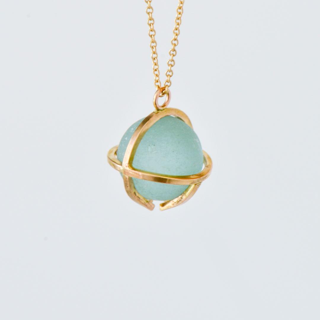 Kate Samson Gold and Lake Ontario Beach Glass Marble Caged Pendant Necklace in Pale Aqua at Inner Beach Co, Toronto, Ontario, Canada