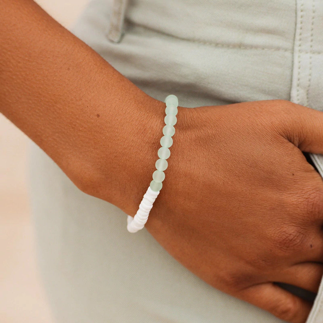 Pura Vida Puka Shell & Frosted Bead Stretch Bracelet in Mint feature natural puka shell beads and bright frosted beads at Inner Beach Co, Toronto, Ontario, Canada