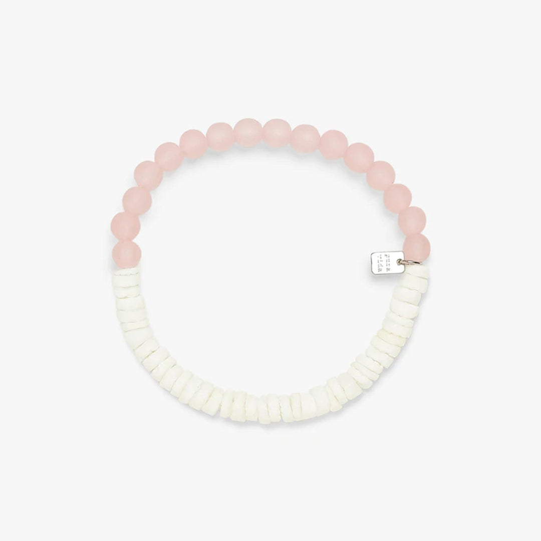 Pura Vida Puka Shell & Frosted Bead Stretch Bracelet in Pink features natural puka shell beads and bright frosted beads at Inner Beach Co, Toronto, Ontario, Canada