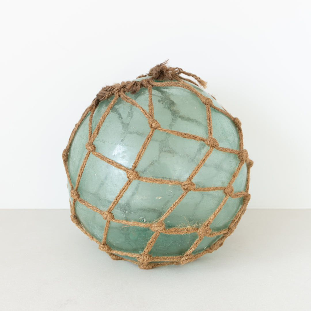 Authentic Japanese large hand-blown glass fishing float with burlap netting at Inner Beach Co, Toronto, Canada