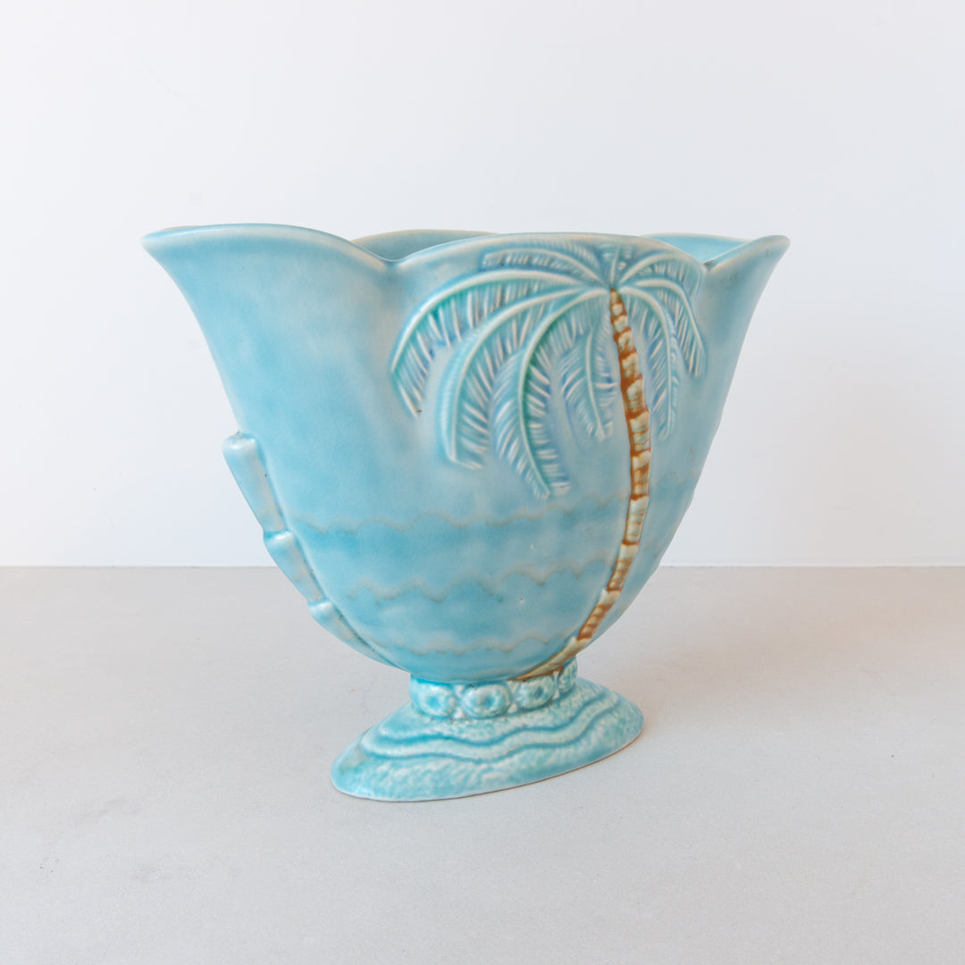 A rare and beautiful pale blue art deco Beswick wide vase with moulded palm tree detail at Inner Beach Co, Toronto, Canada
