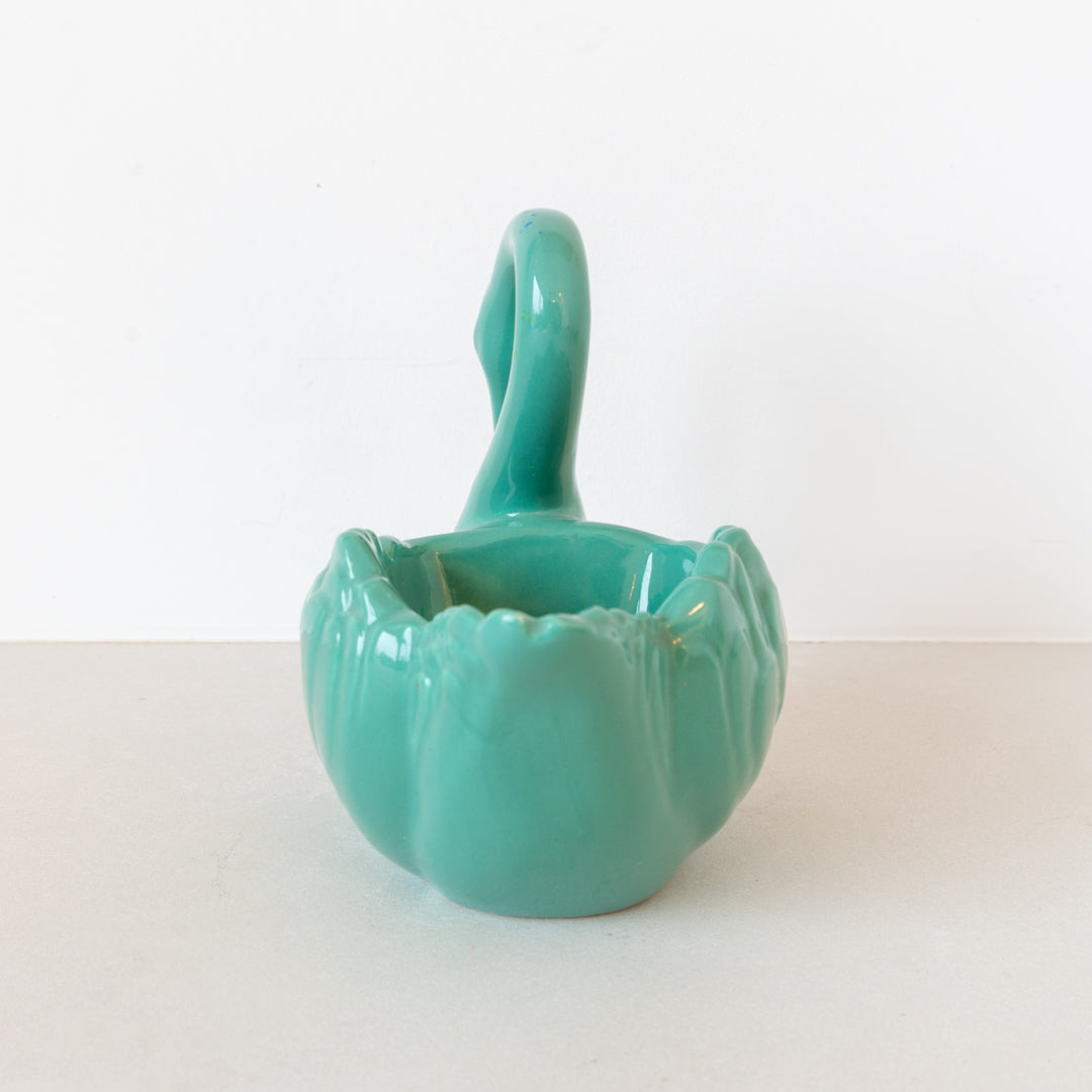 Vintage ceramic swan planter finished in sage green glaze at Inner Beach Co, Toronto, Canada