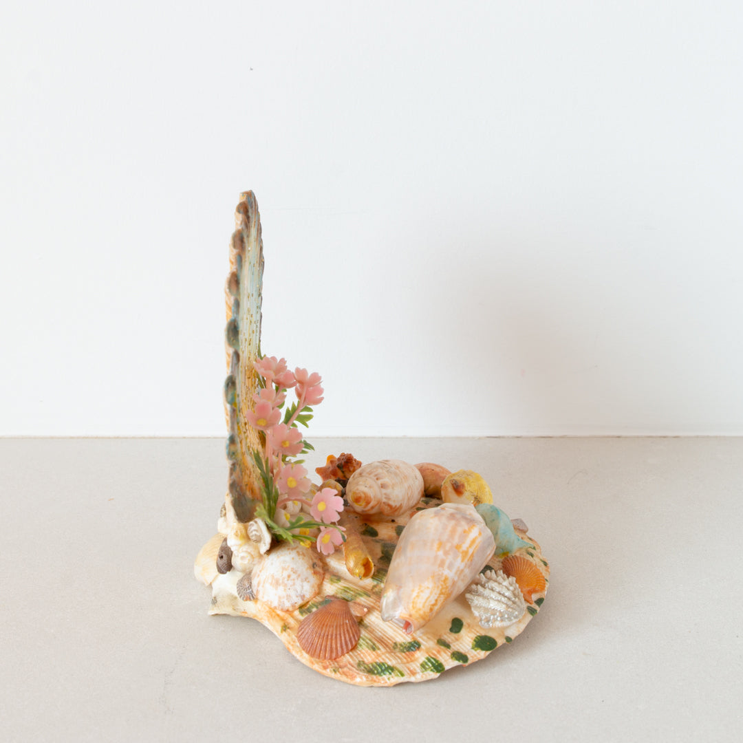 Kitschy vintage shelf ornament from 1960s. An assemblage of shells, plastic flowers, and paint. Inner Beach Co, Toronto, Canada.