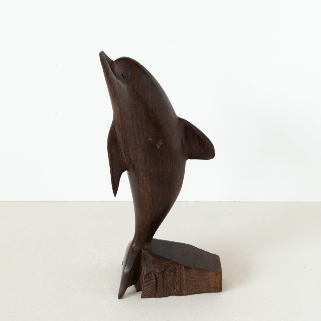 Vintage carved Ironwood dolphin on base at Inner Beach Co, Toronto, Canada