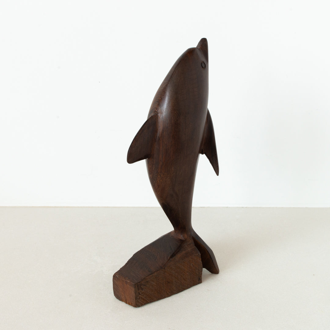 Vintage carved Ironwood dolphin on base at Inner Beach Co, Toronto, Canada