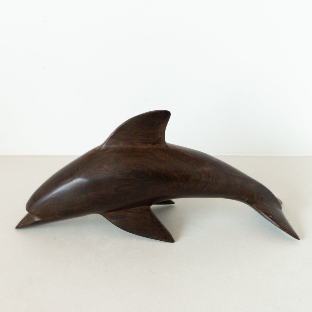 Vintage carved dark wood dolphin at Inner Beach Co, Toronto, Canada