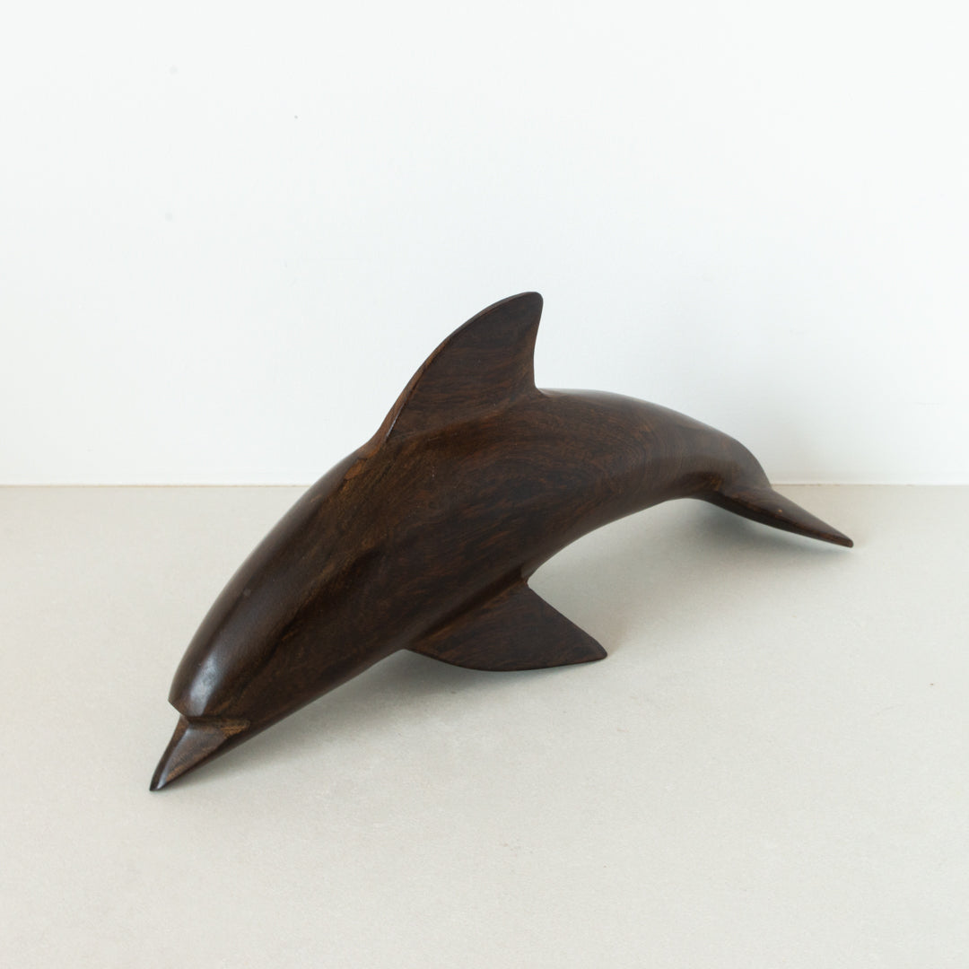 Vintage carved dark wood dolphin at Inner Beach Co, Toronto, Canada