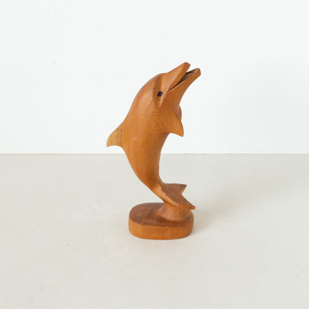 Vintage carved light wood dolphin on base at Inner Beach Co, Toronto, Canada