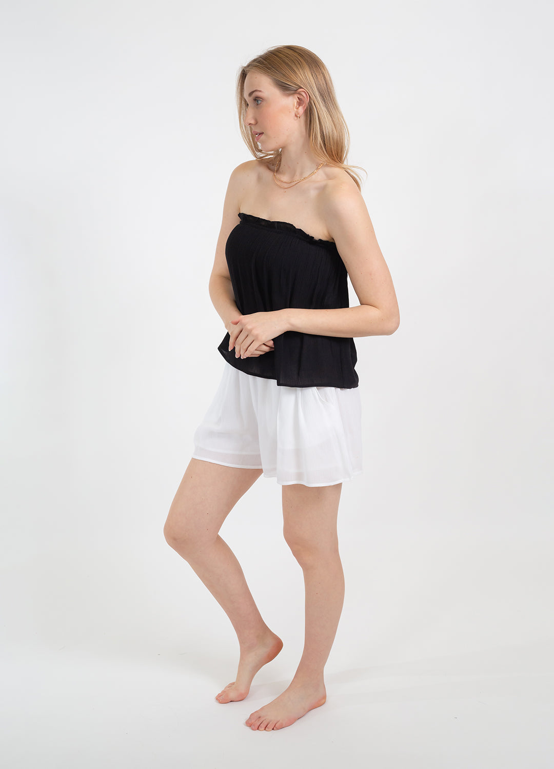 Koy Resort Miami Short in classic white colour made from soft crinkle rayon with an easy elastic ruched waistband at Inner Beach Co, Toronto, Ontario, Canada