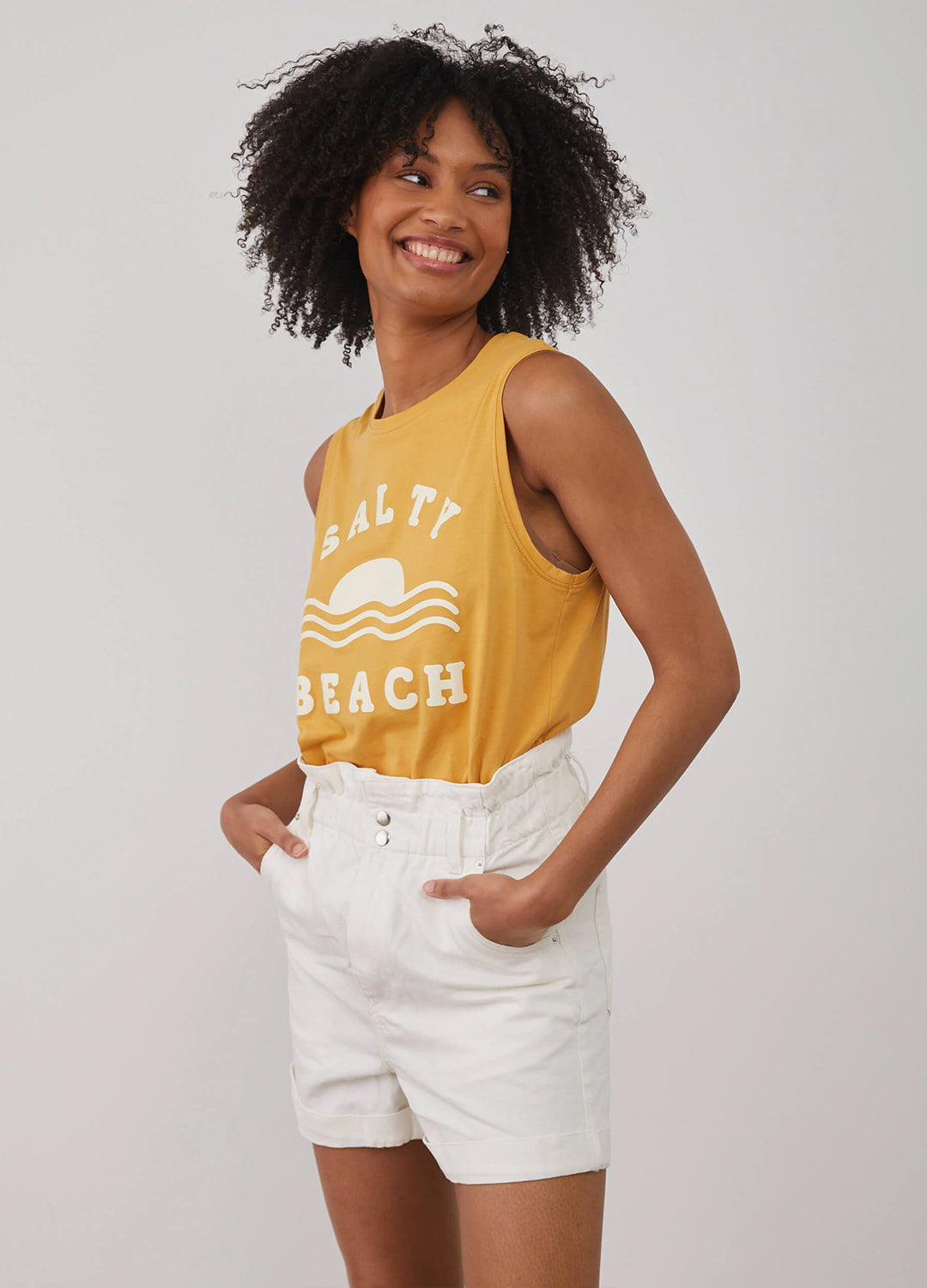 South Parade relaxed fit muscle tee adorned with Salty Beach print made of 100% Pima cotton in a happy honey yellow colour at Inner Beach Co, Toronto, Canada